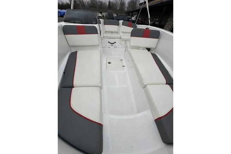 Slide: The Image of 2021 Tahoe T16 boat interior with white and gray seating, red accents. - 14