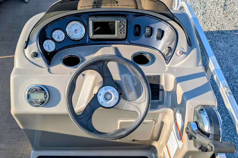 Slide: The Image of 2020 Sun Tracker Party Barge 18 dashboard with steering wheel and gauges. - 5