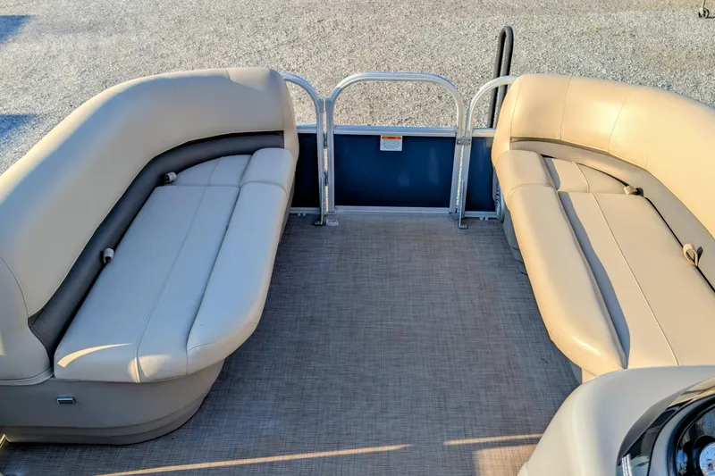 Slide: The Image of 2020 Sun Tracker Party Barge 18 interior with beige seating and spacious layout. - 6
