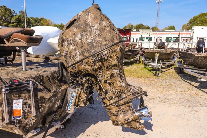 Slide: The Image of 2026 Excel 203 Bay Pro Elite boat with camouflaged outboard motor. - 10