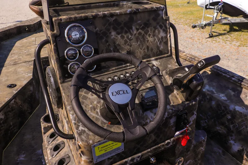 Slide: The Image of Steering wheel and dashboard of Excel 203 Bay Pro Elite 2026. - 11