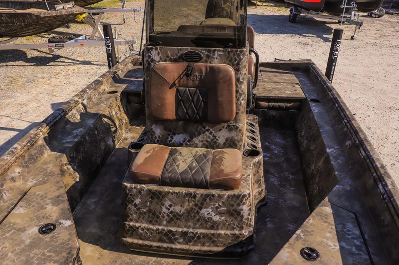Slide: The Image of Interior of Excel 203 Bay Pro Elite 2026 with camouflage design. - 13
