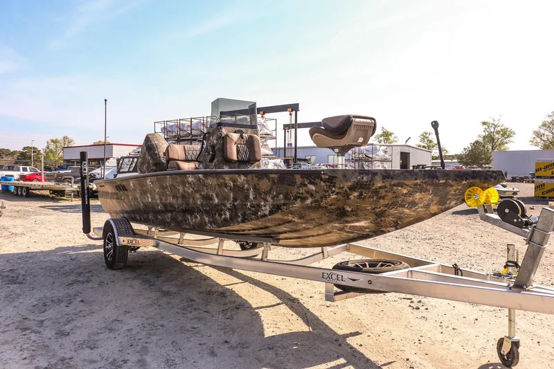 Slide: The Image of 2026 Excel 203 Bay Pro Elite boat on trailer outdoors. - 3