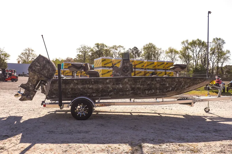 Slide: The Image of 2026 Excel 203 Bay Pro Elite boat on trailer outdoors. - 4