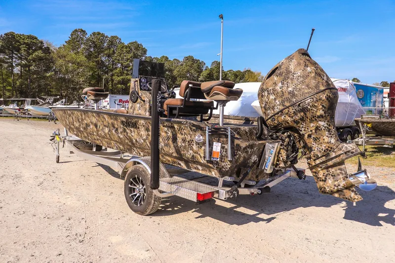 Slide: The Image of 2026 Excel 203 Bay Pro Elite boat with camouflage design on trailer. - 7