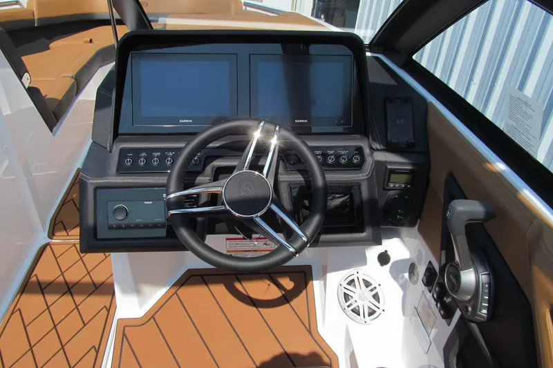 Slide: The Image of 2026 Cobalt R8 boat dashboard with dual Garmin screens and modern controls. - 10