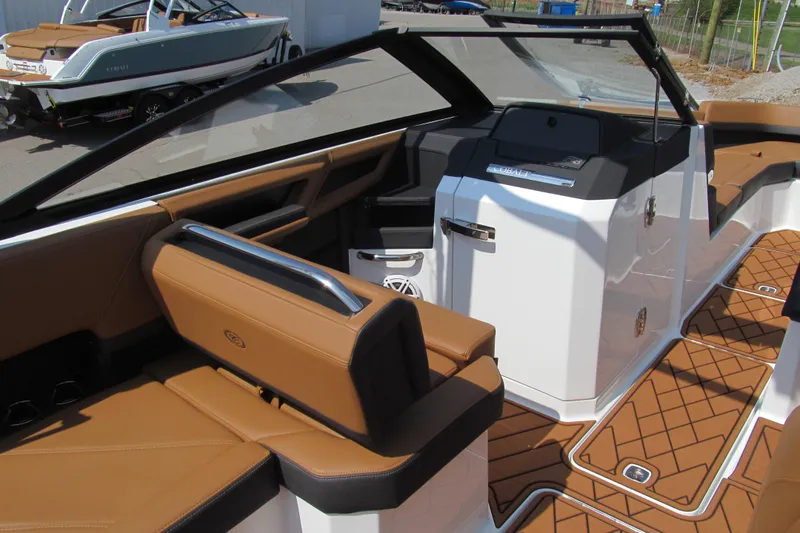 Slide: The Image of Interior of 2026 Cobalt R8 boat with tan seating and modern dashboard. - 11