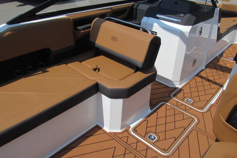 Slide: The Image of 2026 Cobalt R8 boat interior with tan and black seating, featuring stylish flooring. - 12