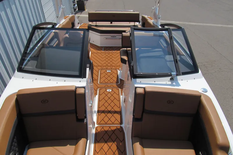 Slide: The Image of 2026 Cobalt R8 boat interior with brown seating and sleek design. - 16
