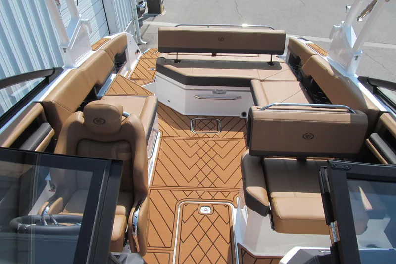 Slide: The Image of 2026 Cobalt R8 boat interior with tan leather seating and patterned flooring. - 17