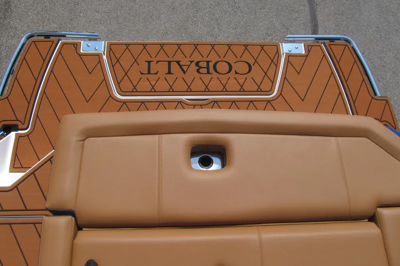 Slide: The Image of 2026 Cobalt R8 boat deck with tan upholstery and diamond-patterned flooring. - 20