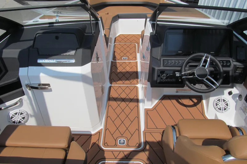 Slide: The Image of 2026 Cobalt R8 boat interior with sleek dashboard, modern controls, and luxurious seating. - 9