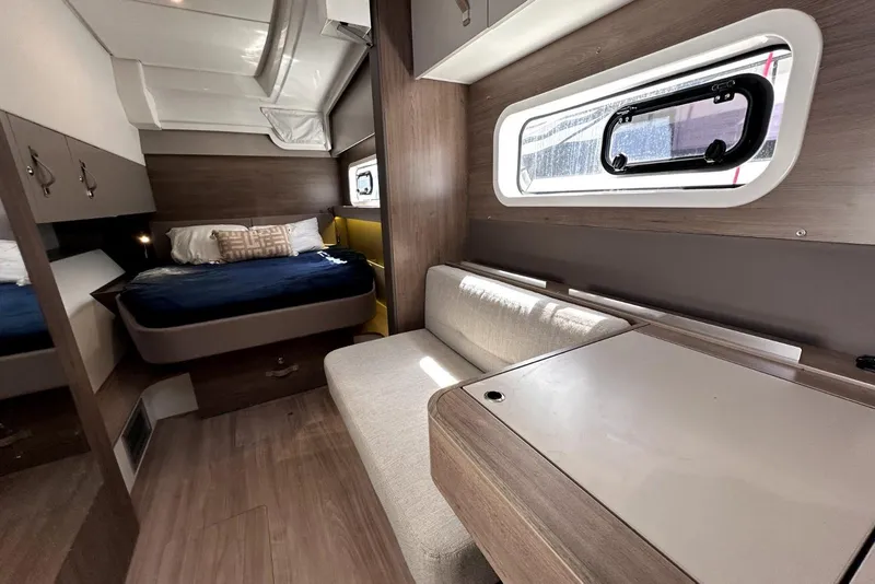 Slide: The Image of Modern interior of 2023 Bali CATSPACE catamaran with cozy bed and seating area. - 18