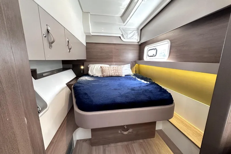 Slide: The Image of 2023 Bali CATSPACE cabin interior with cozy bed, modern design, and ample storage. - 22