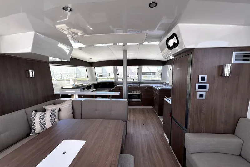 Slide: The Image of Luxurious interior of 2023 Bali CATSPACE catamaran with modern kitchen and seating area. - 27