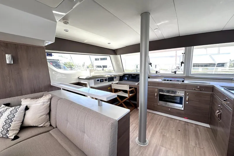 Slide: The Image of Modern interior of 2023 Bali CATSPACE catamaran with kitchen and seating area. - 29