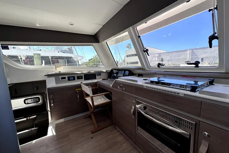 Slide: The Image of Interior of 2023 Bali CATSPACE yacht with modern kitchen and large windows. - 32