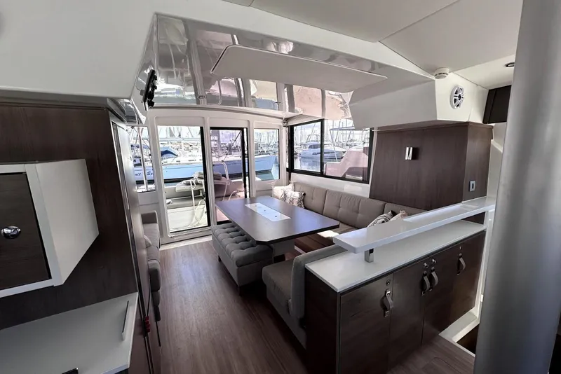 Slide: The Image of Luxurious interior of 2023 Bali CATSPACE catamaran with modern seating and large windows. - 34