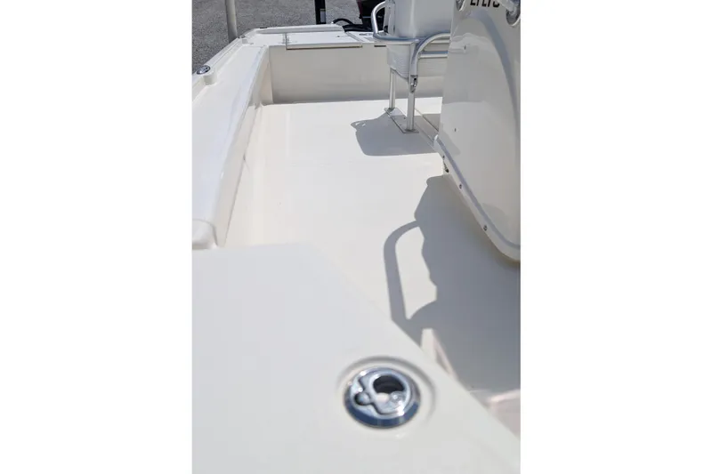 Slide: The Image of 2021 Mako 21 LTS boat interior, showcasing seating and deck details. - 13
