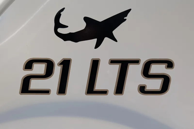 Slide: The Image of 2021 Mako 21 LTS boat logo with shark silhouette on white background. - 16
