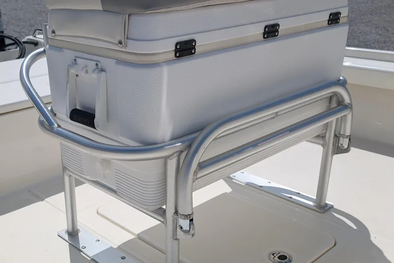 Slide: The Image of 2021 Mako 21 LTS boat cooler seat with metal frame and cushion. - 8