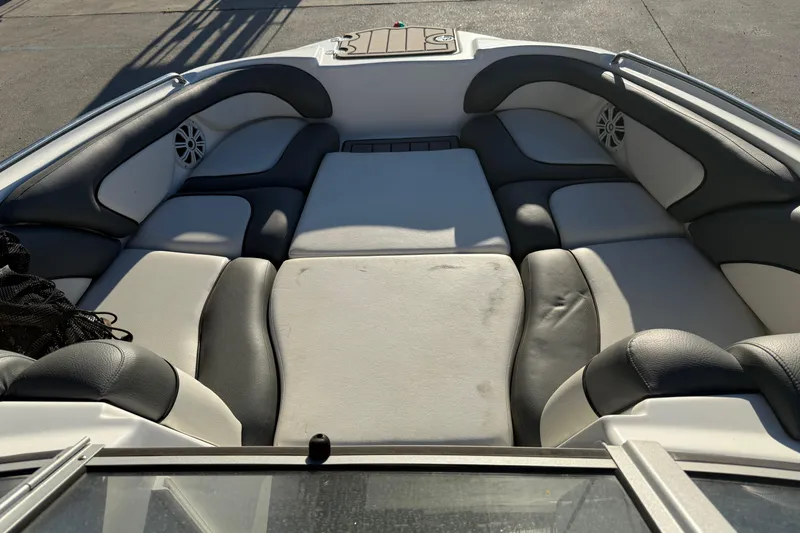 Slide: The Image of Interior seating of a 2011 Yamaha Boats 242 Limited S, featuring cushioned seats. - 10