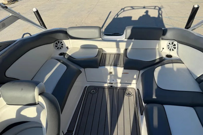 Slide: The Image of 2011 Yamaha Boats 242 Limited S interior with cushioned seating and speakers. - 12