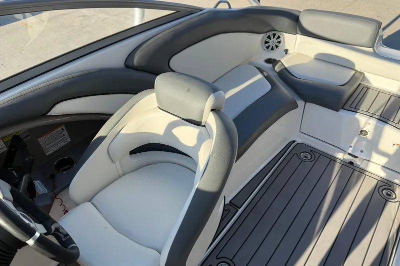 Slide: The Image of Interior of 2011 Yamaha Boats 242 Limited S, featuring sleek seating and modern design. - 13