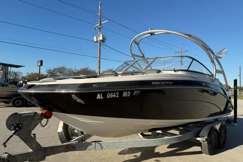 Slide: The Image of 2011 Yamaha Boats 242 Limited S on trailer, high output model, sunny day. - 5