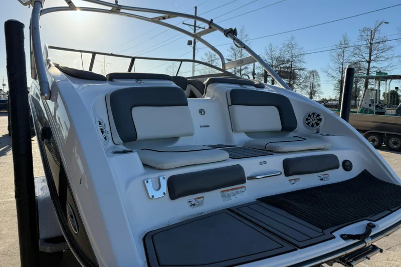 Slide: The Image of 2011 Yamaha Boats 242 Limited S, rear view with seating and swim platform. - 7
