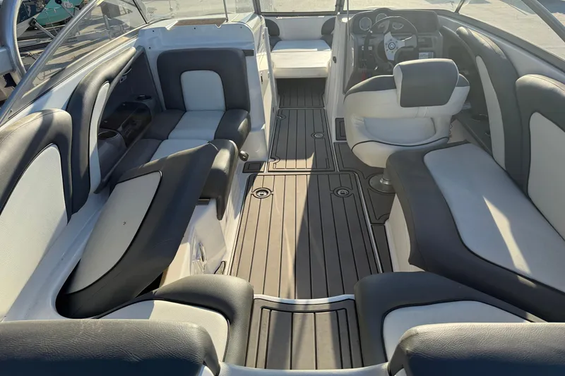Slide: The Image of Interior of a 2011 Yamaha Boats 242 Limited S, featuring sleek seating and modern design. - 8