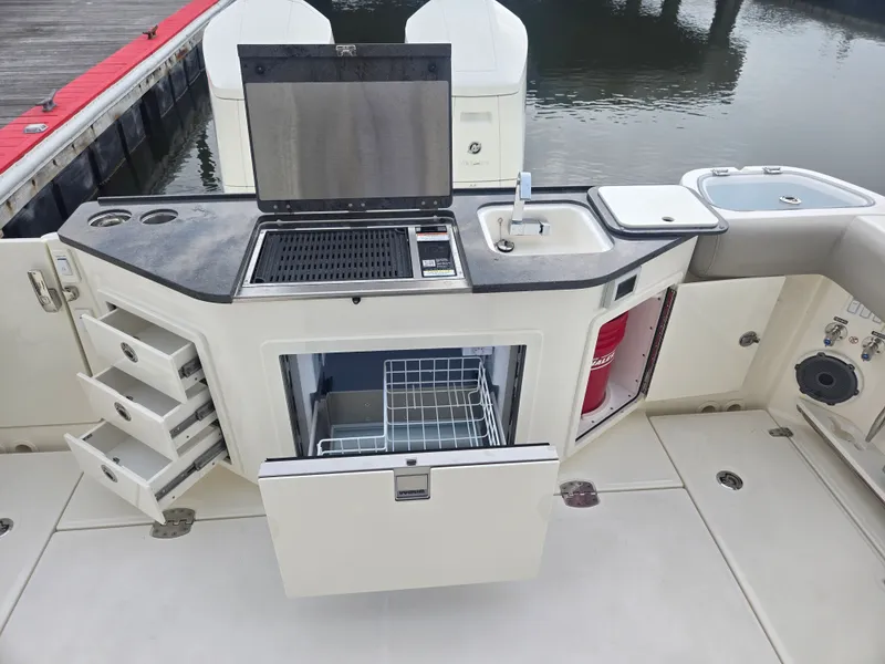 Slide: The Image of Boston Whaler 365 Conquest 2026 with outdoor kitchen and storage. - 10