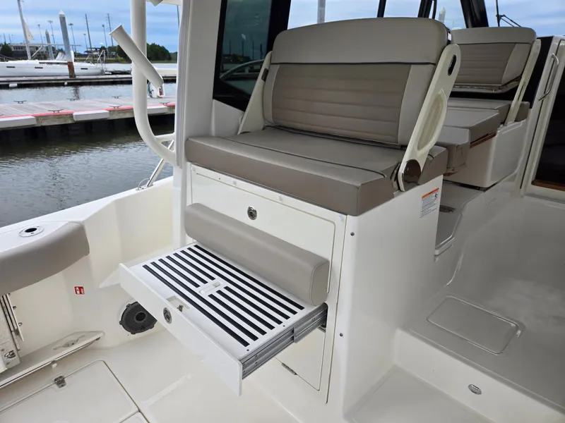 Slide: The Image of Boston Whaler 365 Conquest 2026 with foldable seat and storage. - 19
