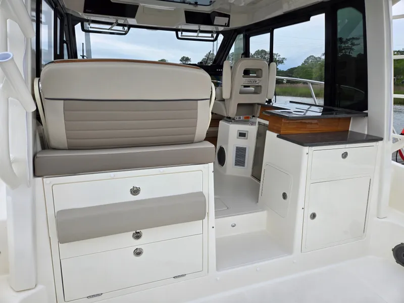 Slide: The Image of Interior of 2026 Boston Whaler 365 Conquest with seating and storage. - 20