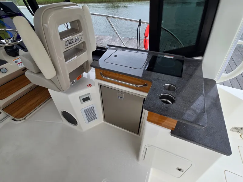 Slide: The Image of Interior of 2026 Boston Whaler 365 Conquest with kitchenette. - 21