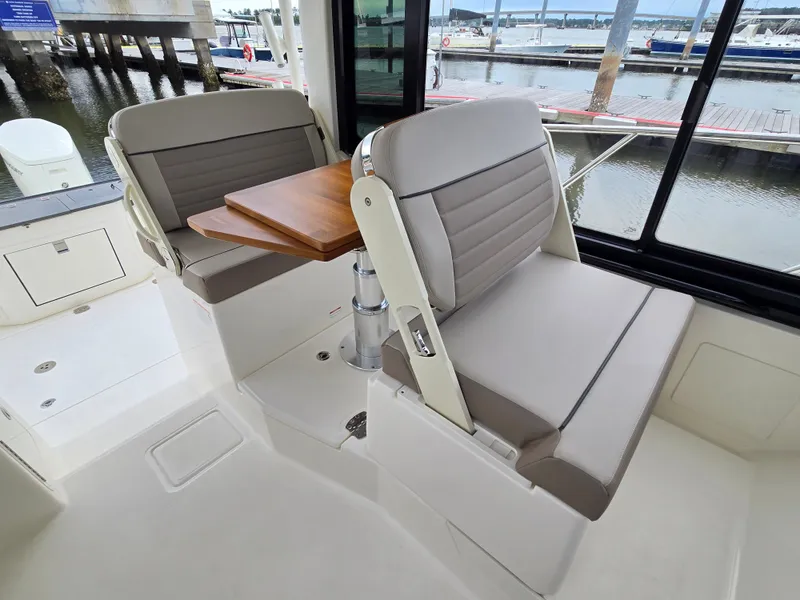 Slide: The Image of Interior of 2026 Boston Whaler 365 Conquest with seating and table. - 25