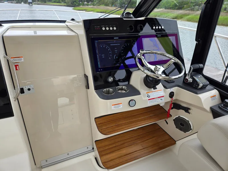 Slide: The Image of Interior view of Boston Whaler 365 Conquest 2026 helm station. - 27