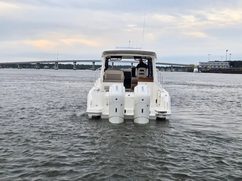 Slide: The Image of 2026 Boston Whaler 365 Conquest on calm waters at sunset. - 3