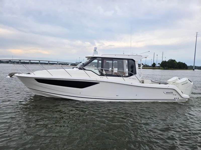 Slide: The Image of 2026 Boston Whaler 365 Conquest on calm waters. - 6