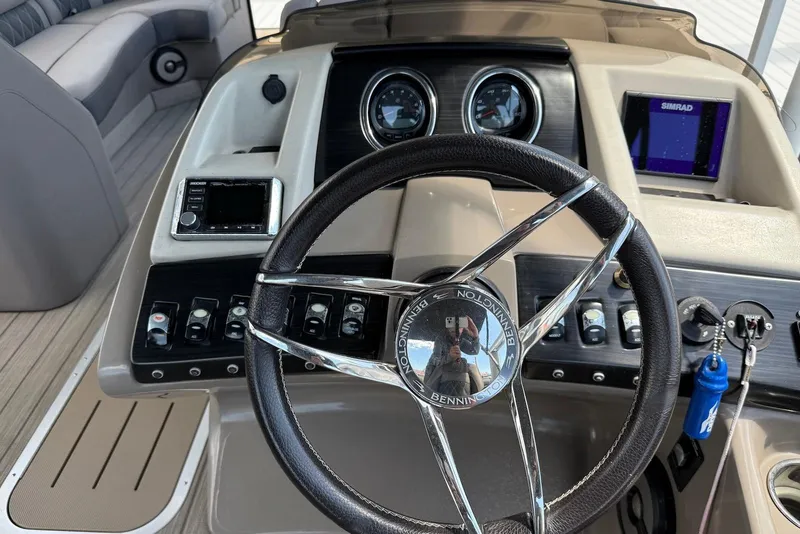 Slide: The Image of Steering console of 2019 Bennington R 23 RSFB boat with controls and gauges. - 10