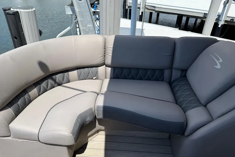 Slide: The Image of Luxurious seating on a 2019 Bennington R 23 RSFB pontoon boat, featuring elegant upholstery. - 14