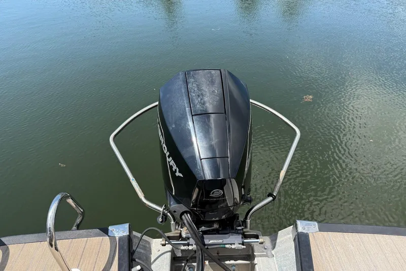 Slide: The Image of 2019 Bennington R 23 RSFB boat with Mercury outboard motor on calm water. - 16