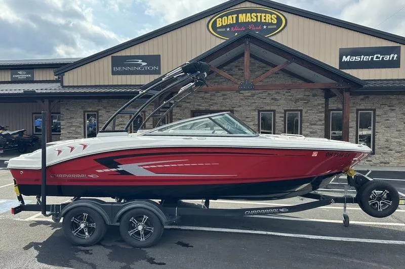 The Image of 2023 Chaparral 21 SSi boat in red on trailer, parked at Boat Masters dealership. - 1