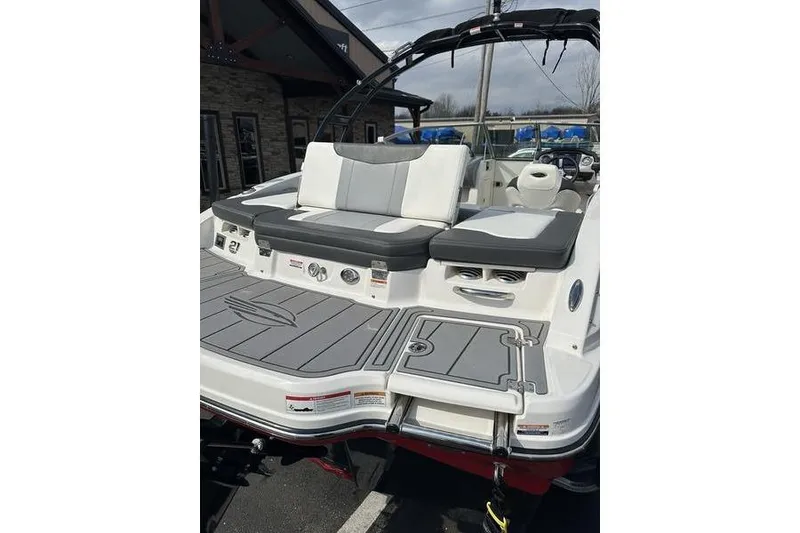 Slide: The Image of 2023 Chaparral 21 SSi boat with sleek seating and swim platform. - 11