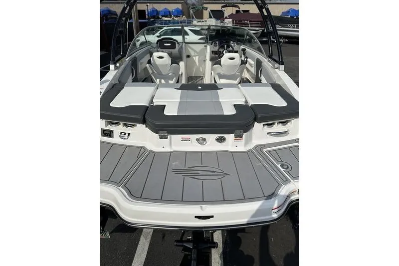 Slide: The Image of 2023 Chaparral 21 SSi boat with sleek seating and modern design. - 12