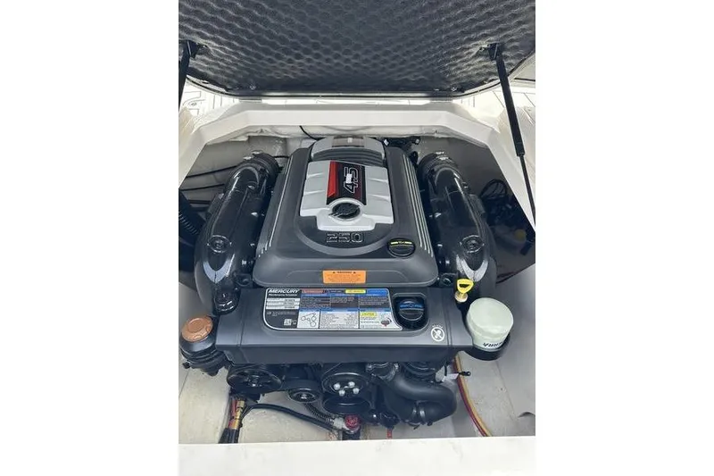 Slide: The Image of 2023 Chaparral 21 SSi boat engine compartment showcasing powerful motor design. - 3