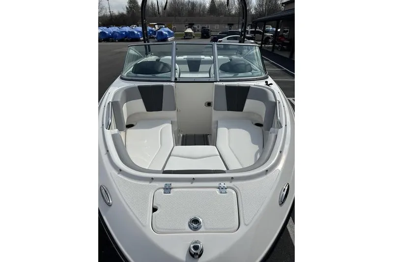 Slide: The Image of 2023 Chaparral 21 SSi boat interior with white seating and windshield. - 8