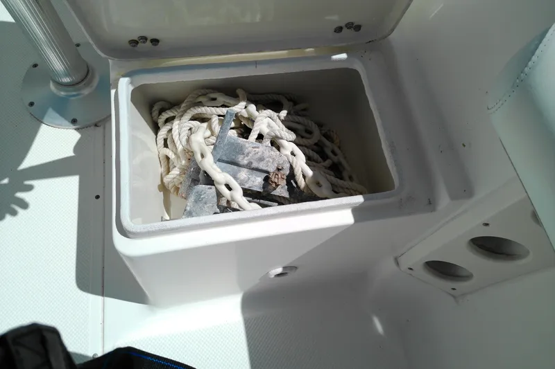Slide: The Image of Storage compartment on 2009 Key West 2020 Walkaround boat with rope and weights. - 12