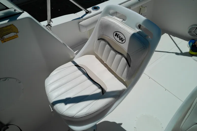 Slide: The Image of White leather seat on 2009 Key West 2020 Walkaround boat, featuring KW logo. - 14
