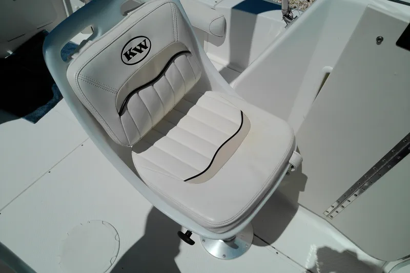 Slide: The Image of White captain's chair on a 2009 Key West 2020 Walkaround boat. - 15